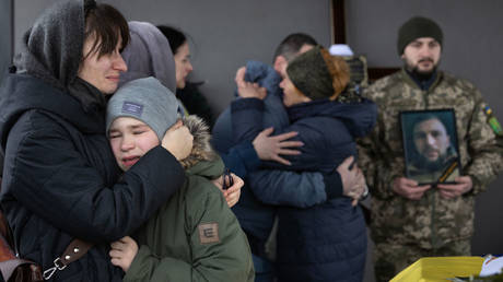 Family members attend the funeral of a Ukrainian soldier who was killed near Avdeevka on Wednesday.