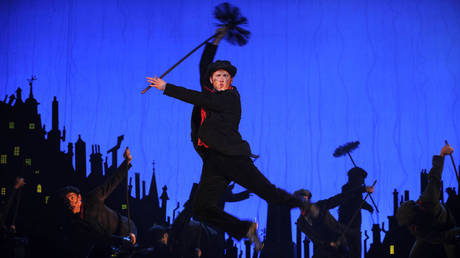 A chimney sweep dances on rooftops during a dress rehearsal for a Mary Poppins stage production in Australia