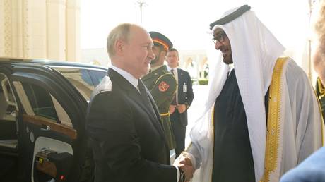  Russian President Vladimir Putin is greeted by President of the United Arab Emirates Sheikh Mohamed bin Zayed Al Nahyan before a meeting at Qasr Al Watan Palace in Abu Dhabi, United Arab Emirates.