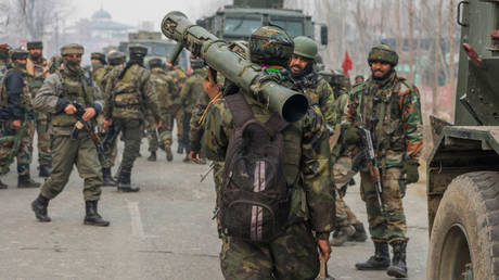 An Indian soldier carries a Carl-Gustaf M4 grenade launcher in December 2018 in Kashmir.