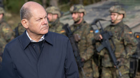 FILE PHOTO, German Chancellor Olaf Scholz speaks with soldiers of the Bundeswehr while visiting the Bundeswehr army training center in Ostenholz on October 17, 2022 near Hodenhagen, Germany.