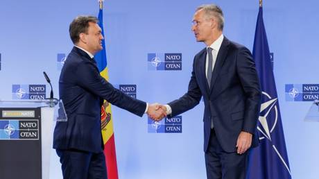 FILE PHOTO: NATO Secretary General Jens Stoltenberg welcomes Moldova’s PM Dorin Recean at NATO Headquarters in Brussels.