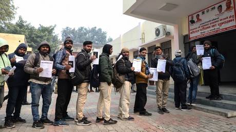 Indian workers align to submit registration forms as they seek employment in Israel during a recruitment drive at the Industrial Training Institute (ITI) in Lucknow, capital of India's Uttar Pradesh state on January 25, 2024.