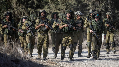 FILE PHOTO: Israeli soldiers patrol near the Gaza border.
