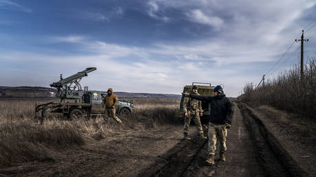 FILE PHOTO: Ukrainian soldiers prepare to fire missiles from a homemade launcher, March 5, 2024
