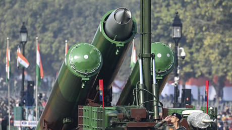 A soldier salutes from a Brahmos Weapon system as they march along Rajpath during the Republic Day parade in New Delhi in 2021.