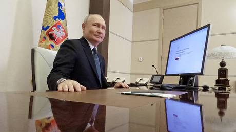 Russian President Vladimir Putin votes online during the presidential election at the Novo-Ogaryovo state residence, outside Moscow, Russia.