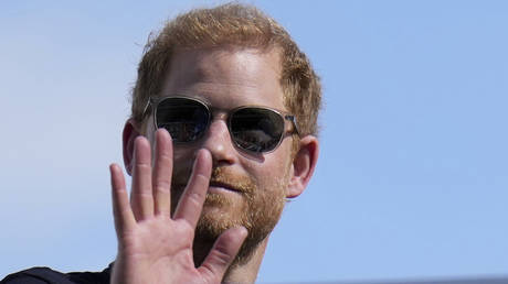 Prince Harry waves during the Formula One US Grand Prix in Austin, Texas, October 22, 2023