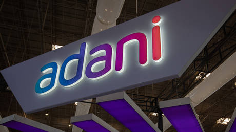 The logo of the Adani group is seen in a pavilion during the Aero India 2023 at the Yelahanka Air Force Station on February 14, 2023 in Bengaluru, India. The five-day event is held to showcase India's aerospace and defence capabilities.