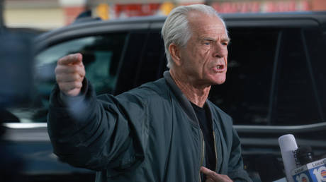 Former White House aide Peter Navarro speaks to reporters on Tuesday before reporting to a federal prison in Miami.