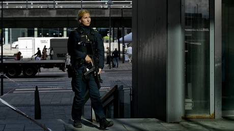 FILE PHOTO: A policewoman in Copenhagen after the deadly shooting of three people, in July, 2022.