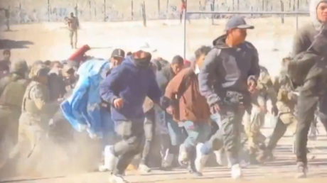 A screenshot of a video posted on X (formerly Twitter) shows migrants rushing through a breach in the US-Mexico border near El Paso, Texas.