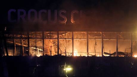The burning Crocus City Hall concert venue following a terrorist attack.