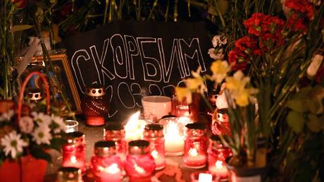 Flowers at a makeshift memorial near the Crocus City Hall in memory of the victims of a terrorist attack on the concert venue near Moscow