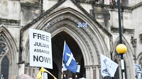 FILE PHOTO: Julian Assange supporters rally outside the Royal Courts of Justice in London.