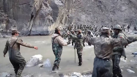 A video frame grab taken from footage recorded in June, 2020 and released by China Central Television (CCTV) on February 20, 2021 showing Chinese and Indian soldiers during an incident in the Galwan Valley