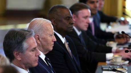 FILE PHOTO: US President Joe Biden (2nd left) and senior members of his administration.