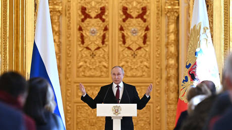 FILE PHOTO: Russian President Vladimir Putin delivers a speech during a meeting with election campaign workers at the Grand Kremlin Palace, in Moscow, Russia.