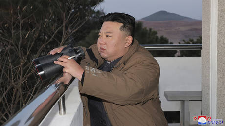  North Korean leader Kim Jong Un witnessing the launch of a Hwasong-17 intercontinental ballistic missile (ICBM) from Pyongyang International Airport.