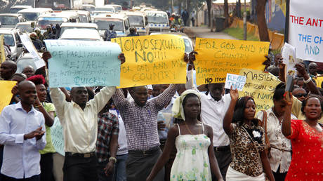 FILE PHOTO: Anti-Homosexual activists march on the streets of Kampala carrying placards.