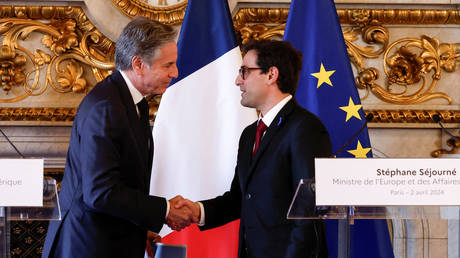 US Secretary of State Antony Blinken (L) and French Foreign Minister Stephane Sejourne (R) shake hands at the end of a joint press conference after their meeting at the Ministry of Foreign Affairs in Paris on April 2, 2024.