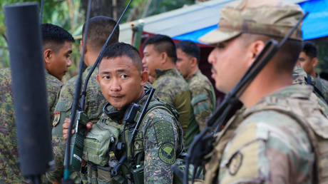 US and Filipino troops take part in a joint drill last April near New Clark City, Philippines.
