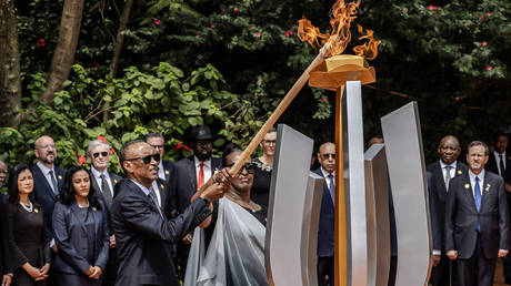 President of Rwanda Paul Kagame (C L) and his wife Jeannette Kagame (C R) light a remembrance flame surrounded by heads of state and other dignitaries as part of the commemorations of the 30th Anniversary of the 1994 Rwandan genocide at the Kigali Genocide Memorial in Kigali on April 7, 2024.