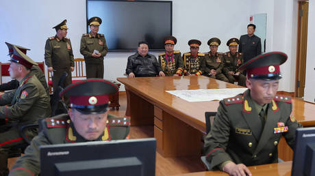 North Korea's leader Kim Jong Un (back C) visiting Kim Jong Il University of Military and Politics in west Pyongyang.