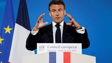 French President Emmanuel Macron gestures during a press conference at the end of the European Council summit at the EU headquarters in Brussels, on April 18, 2024.