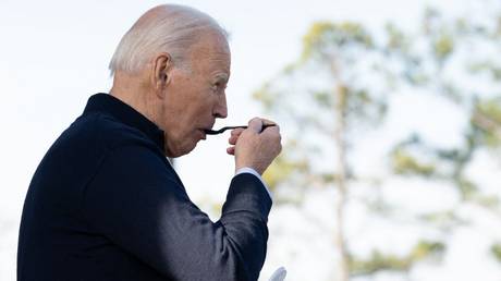 Joe Biden eats a milkshake during a campaign stop in Raleigh, North Carolina, January 18, 2024