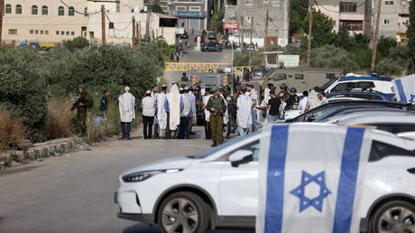  Jewish settlers block entry and exit roads to the town of Al-Lubban ash-Sharqiya near Nablus, West Bank.