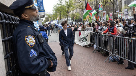 Pro-Palestine protesters show solidarity with the arrested students outside the locked gates of Columbia University, New York, April 21, 2024