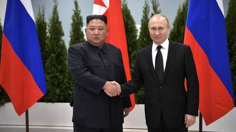 North Korea leader Kim Jong Un (L) attends a meeting with Russian President Vladimir Putin (R).