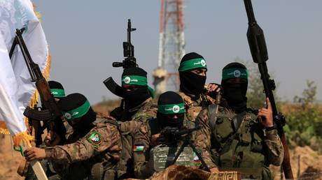  Palestinian fighters of the al-Qassam Brigades, the armed wing of the Hamas movement.