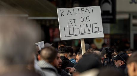 A placard reading: ‘Caliphate is the solution’ during a rally in Hamburg, Germany, April 27, 2024.