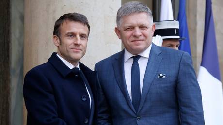 France's President Emmanuel Macron greets Slovakia's Prime Minister Robert Fico  at the Elysee presidential palace in Paris,