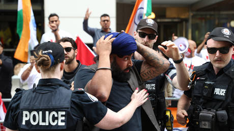 Police arrest a Sikh protestor as Pro-Khalistan supporters gather for a demonstration in front of the Consulate General of India in Toronto, Ontario, Canada on July 8, 2023.