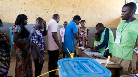 Voters queue to receive theor ballot papers at a polling station at a school in the Abena district, Bureau 2 Carré 27, in N'Djamena on May 6, 2024 during Chad's presidential election.