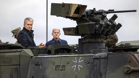 German Chancellor Olaf Scholz and Lithuanian President Gitanas Nauseda during military exercises in Pabrade, Lithuania, May 6, 2024.
