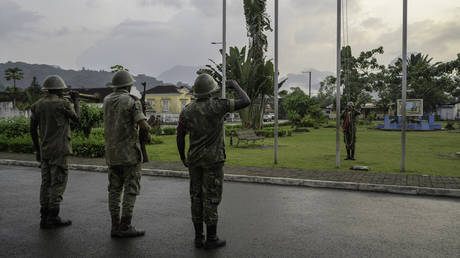 FILE PHOTO: Soldiers lowering the flag of Sao Tomé e Principe during the traditional daily sunset ceremony.