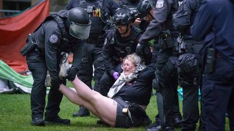 Police remove a protester on the University of Pennsylvania campus, in Philadelphia, on Friday, May 10, 2024.
