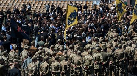 FILE PHOTO: People attend the funeral of a member of the notorious neo-Nazi Azov regiment in Vinnitsa, Ukraine, May 10, 2024