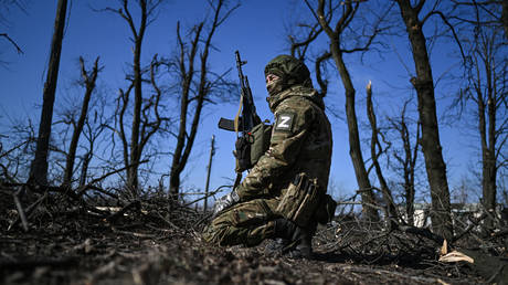 FILE PHOTO: A Russian serviceman patrols an area amid Russia's military operation in Ukraine.