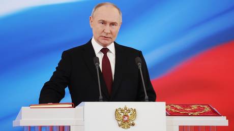 Russian President Vladimir Putin takes the oath of office during his inauguration ceremony at the Kremlin in Moscow, Russia.