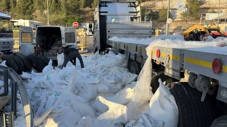 Humanitarian aid supplies dumped by Jewish settlers on the road near Tarqumiyah military checkpoint in Hebron, West Bank on May 13, 2024.