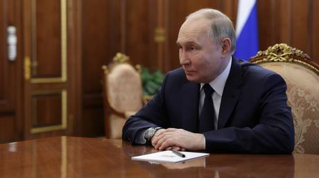 Russian President Vladimir Putin presides over a government meeting in Moscow on May 10, 2024.