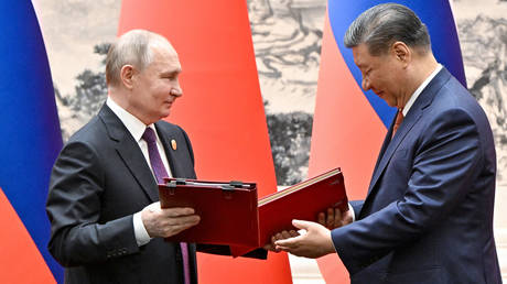 Russian President Vladimir Putin and Chinese President Xi Jinping attend a signing ceremony following a meeting in expanded format at the Great Hall of the People in Beijing, China.