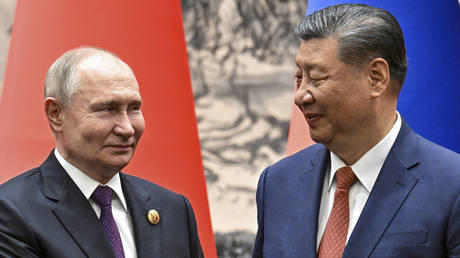 Chinese President Xi Jinping and Russian President Vladimir Putin shake hands prior to their talks in Beijing, China, on Thursday, May 16, 2024.