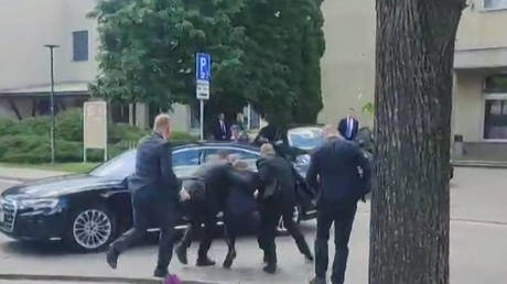 Security personnel carrying Slovakia's Prime Minister Robert Fico after he was shot in Handlova on May 15, 2024. © RTVS / AFP