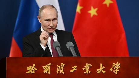 FILE PHOTO: Russian President Vladimir Putin delivers a speech in Harbin, Heilongjiang province, China.